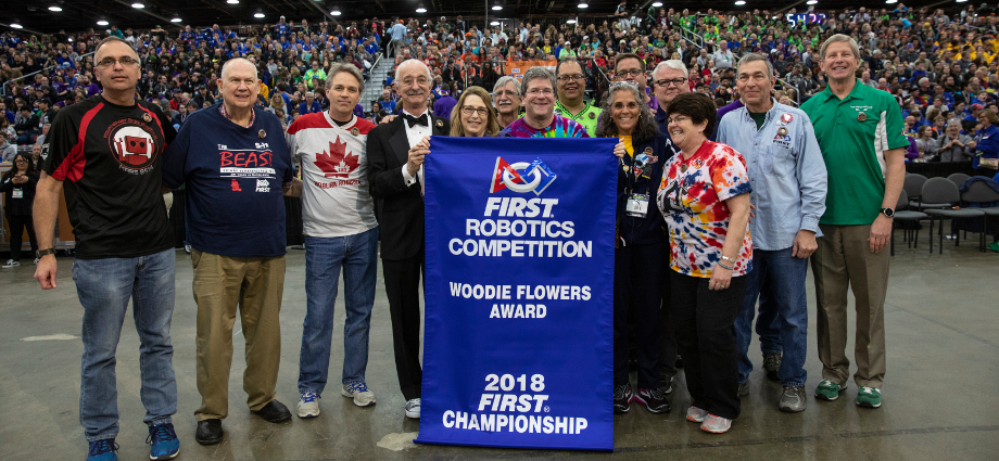 Gail Drake (five from left), recipient of the 2018 Woodie Flowers Award for outstanding mentorship, with Woodie Flowers (four from left) and past winners at the 2018 FIRST Championship.