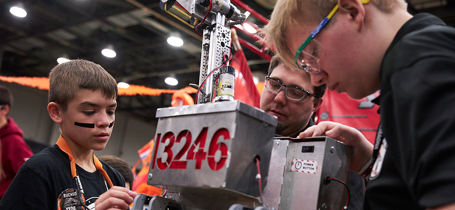 Students work on their robot in the FIRST Tech Challenge pits at FIRST Championship.