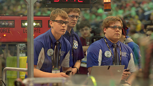 Robot drivers from Team 5172 compete during a match at FIRST Championship.