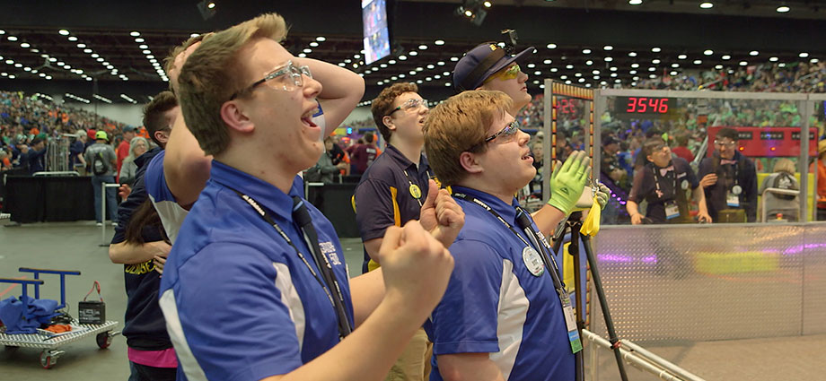 Students from FIRST Robotics Competition Team “Gator Robotics” – based in a small Minnesota near the Canadian border – celebrate during a robotics match at the 2018 FIRST Championship in Detroit.