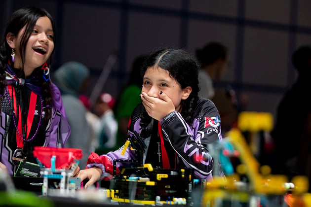 FIRST LEGO League participants during a Robot Game match.