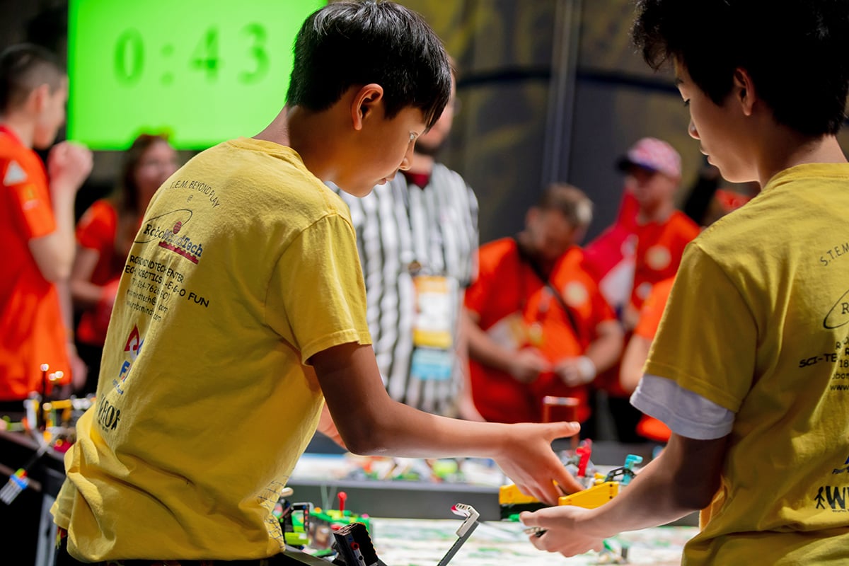 FIRST LEGO League student participants setting up robot at 2026 FIRST Championship