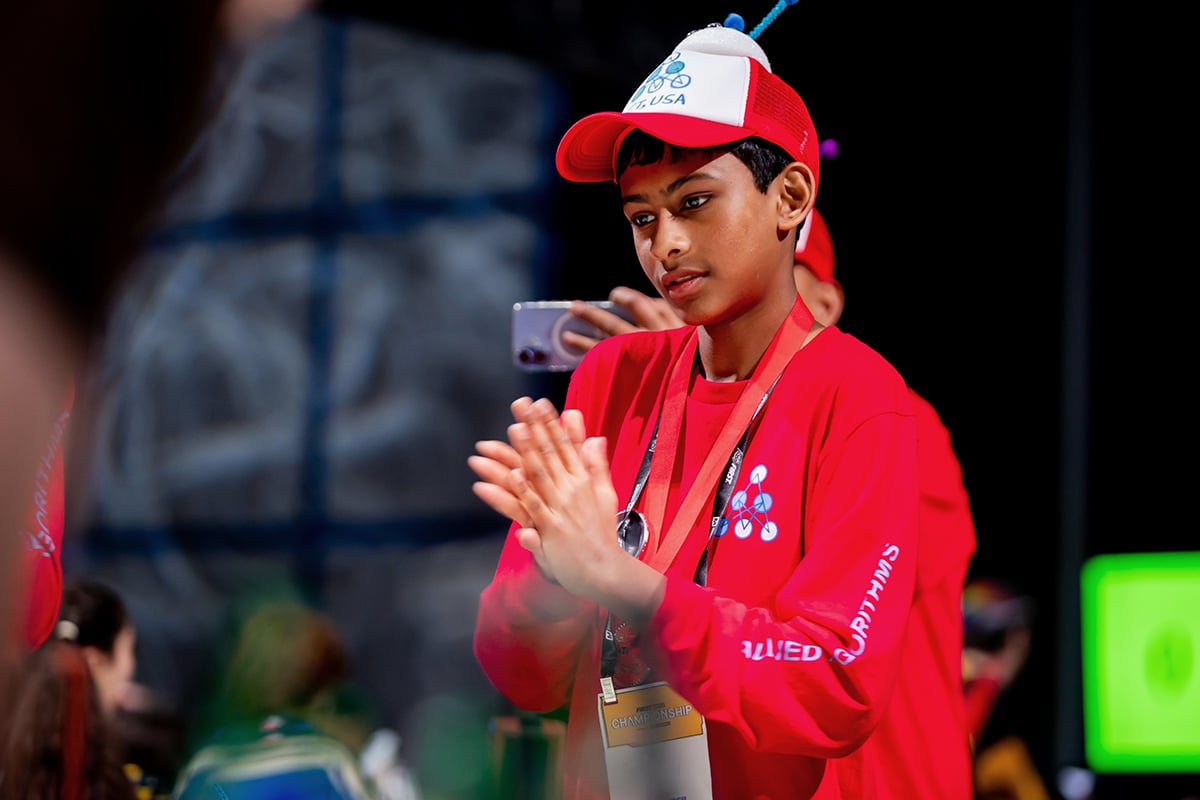 FIRST LEGO League student participant cheering on robot at 2026 FIRST Championship