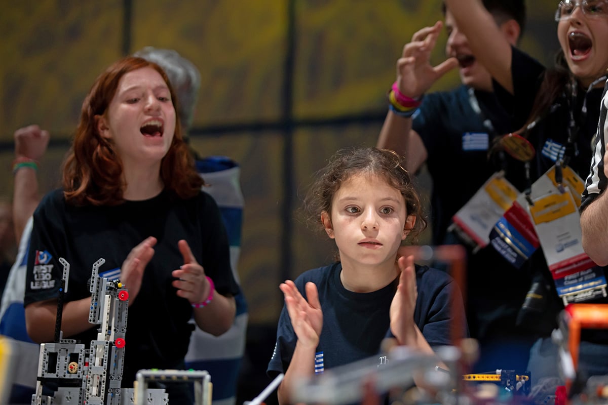 FIRST LEGO League student participants cheering on robot at 2026 FIRST Championship