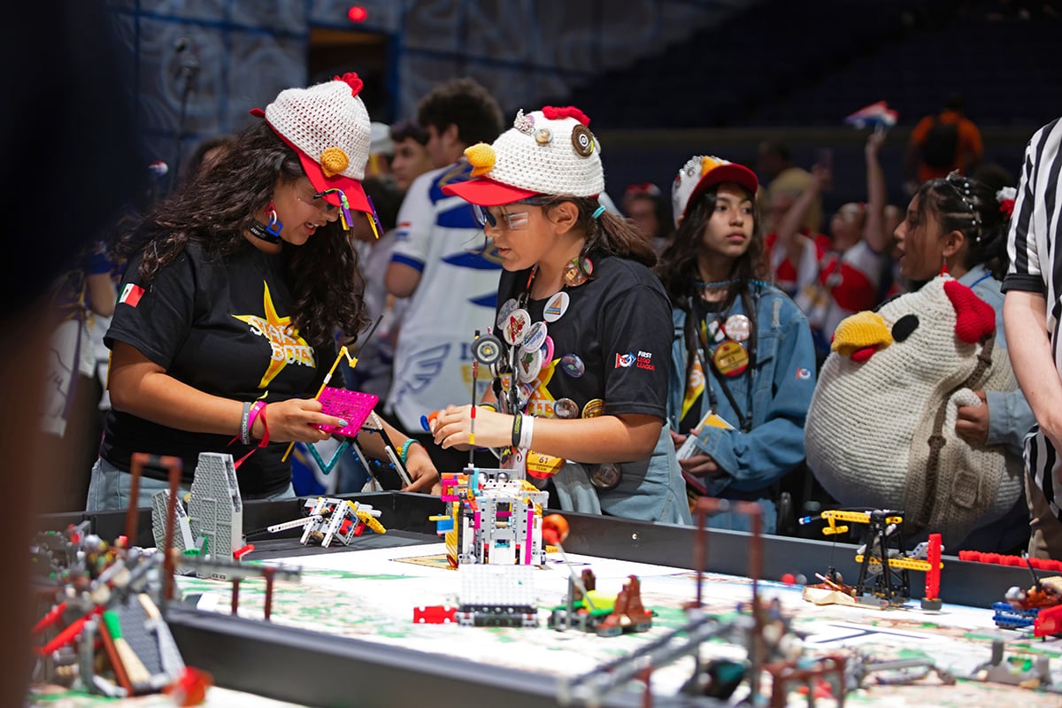 FIRST LEGO League student participant cheering on robot at 2026 FIRST Championship