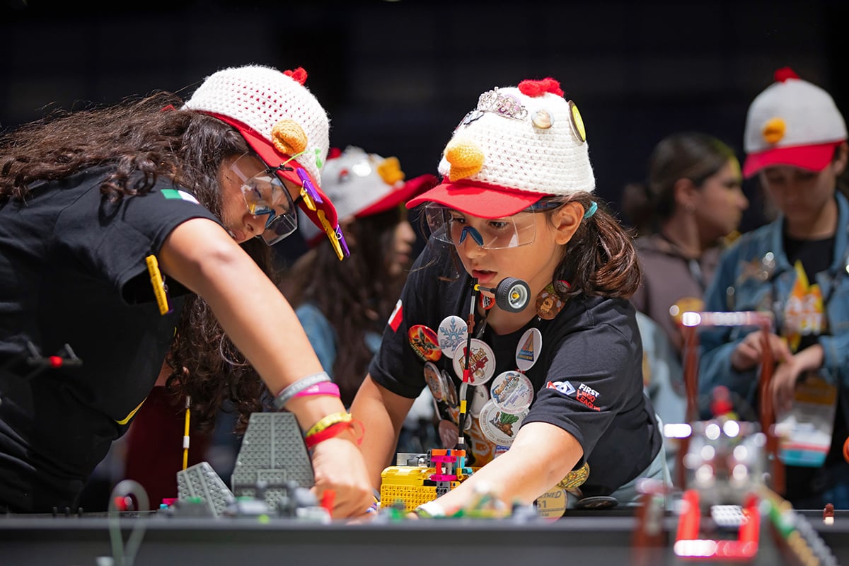 FIRST LEGO League student participants setting up robot at 2026 FIRST Championship
