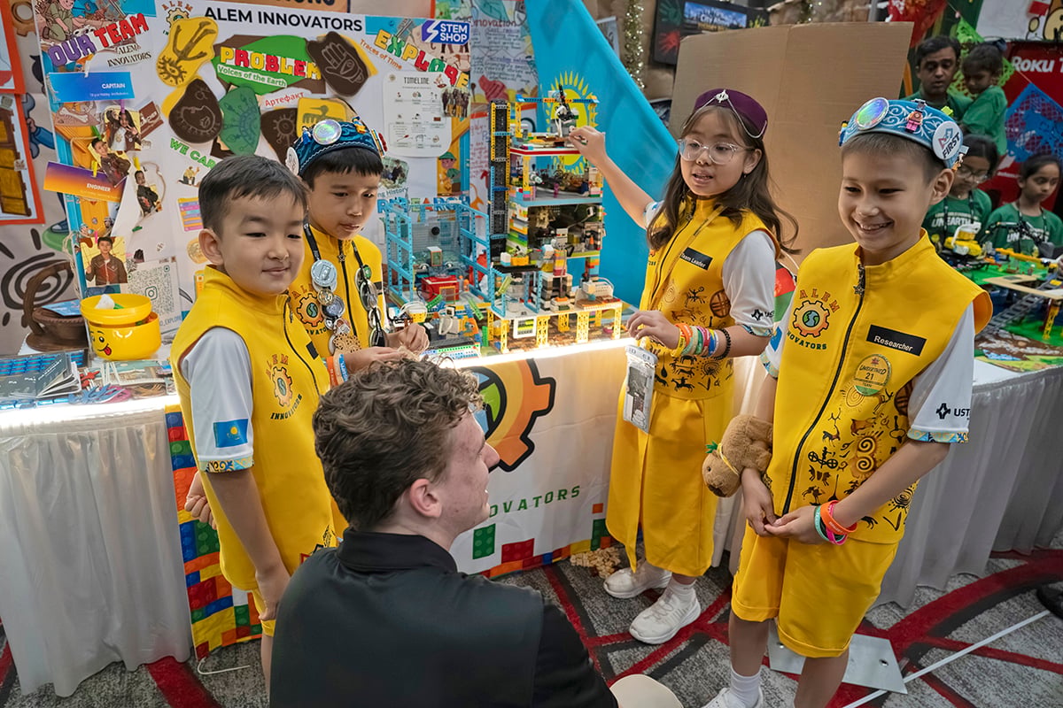 FIRST LEGO League team talking to event volunteer at 2026 FIRST Championship