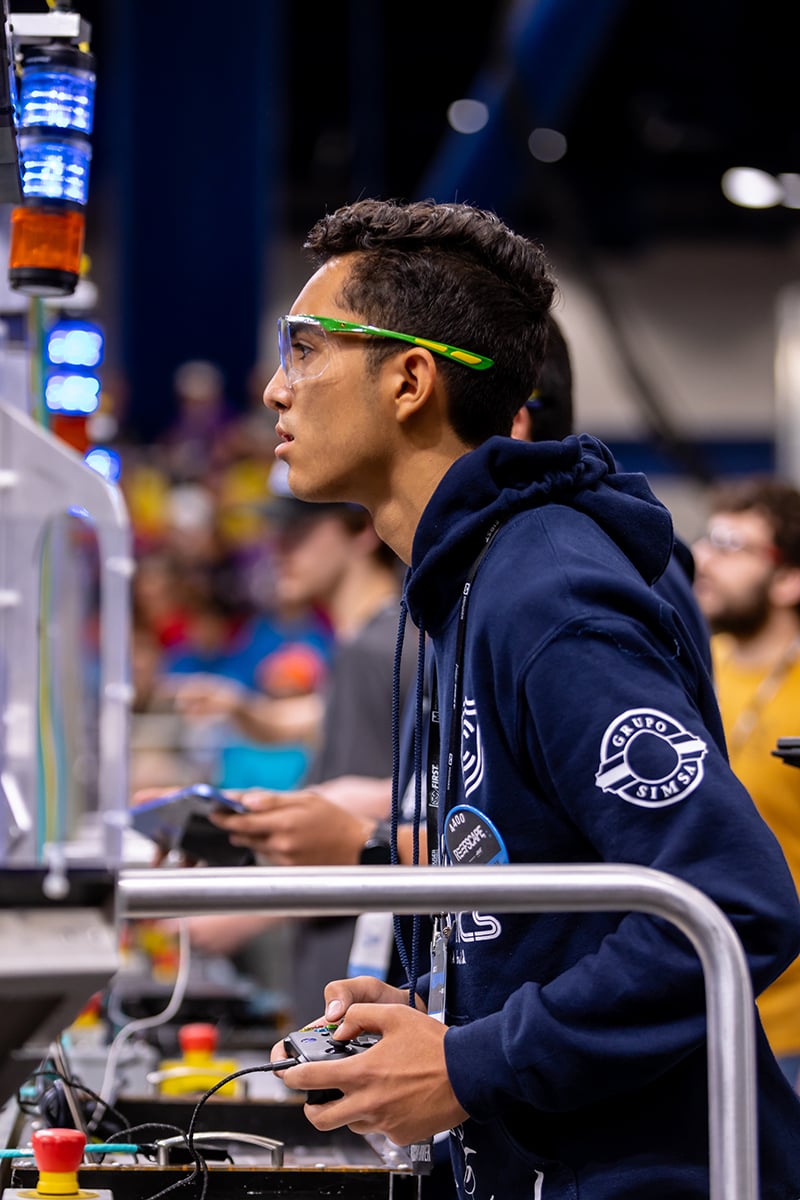 FIRST Robotics Competition student driving robot at FIRST Championship