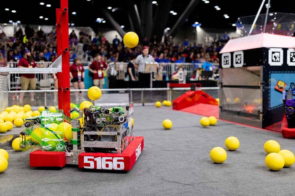 FIRST Robotics Competition robot scoring game objects at 2026 FIRST Championship