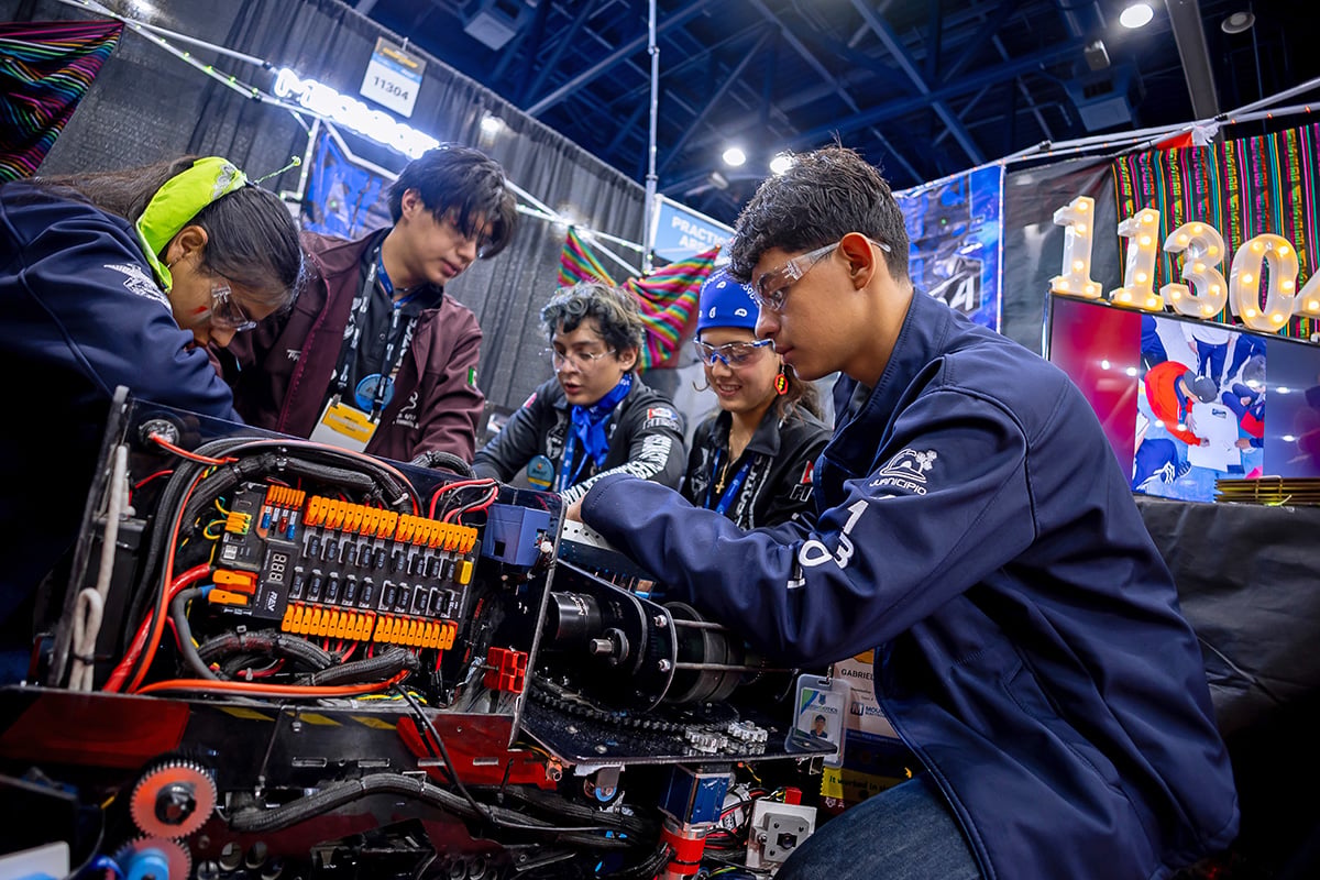 FIRST Robotics Competition students participant working on robot at 2026 FIRST Championship