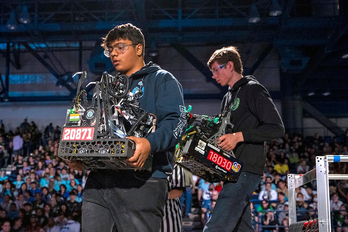 FIRST Tech Challenge students carrying robots at FIRST Championship