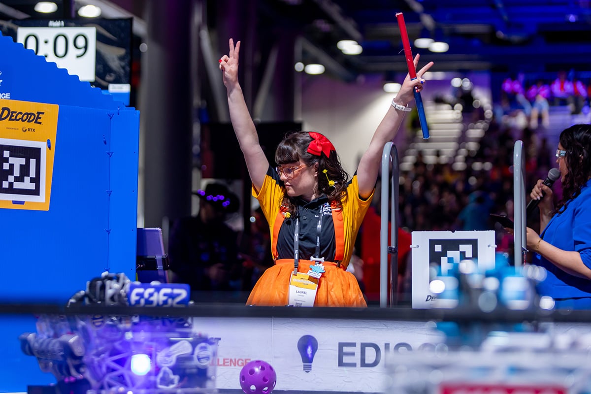 FIRST Tech Challenge event volunteer cheering on robots at 2026 FIRST Championship