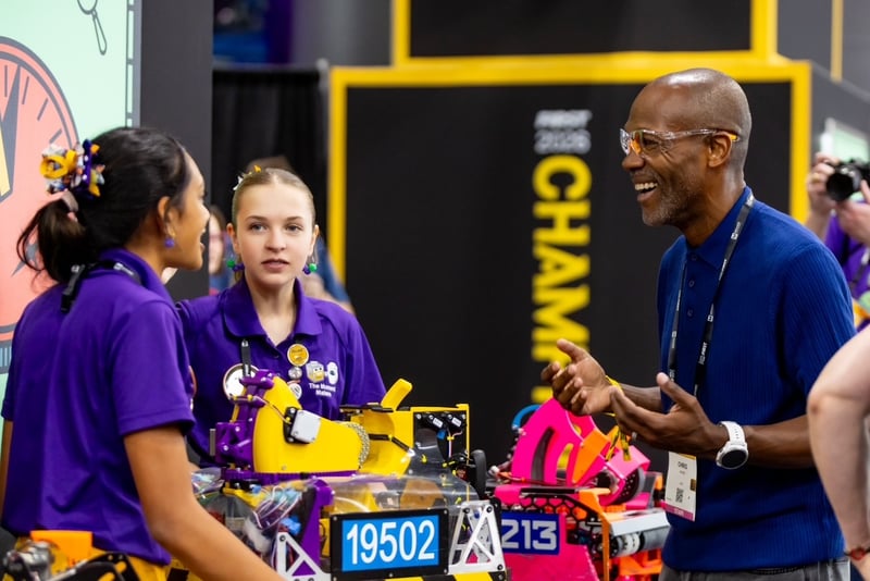 Chris Moore, chief executive officer at FIRST®, greets a team at FIRST Championship in Houston.