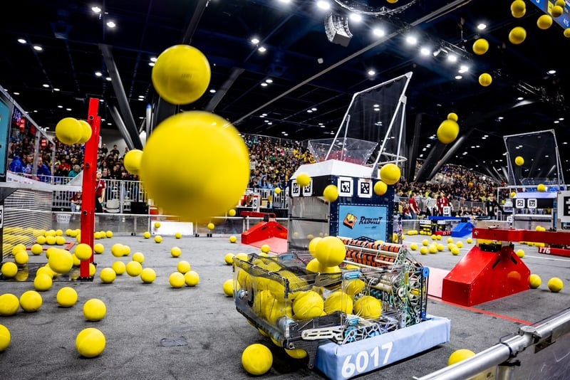 Student-built FIRST® Robotics Competition robots collect “fuel” game pieces to score points during a FIRST Championship qualifying match as part of the REBUILT™ presented by Haas season.