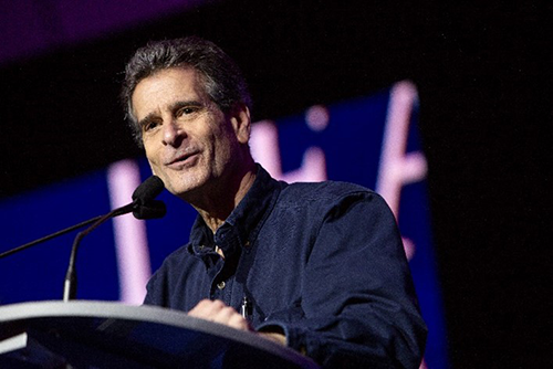 Dean Kamen speaking at podium
