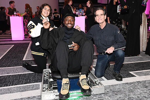 FIRST Robotics Competition student, will.i.am, and Dean Kamen with a robot