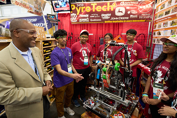 Chris Moore visits with FIRST Robotics Competition Team 3459, PyroTech from Cary, N.C., on April 20 at the 2023 FIRST Championship in Houston. 