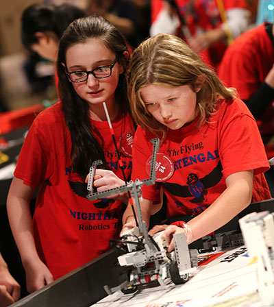 FIRST LEGO League team with robot