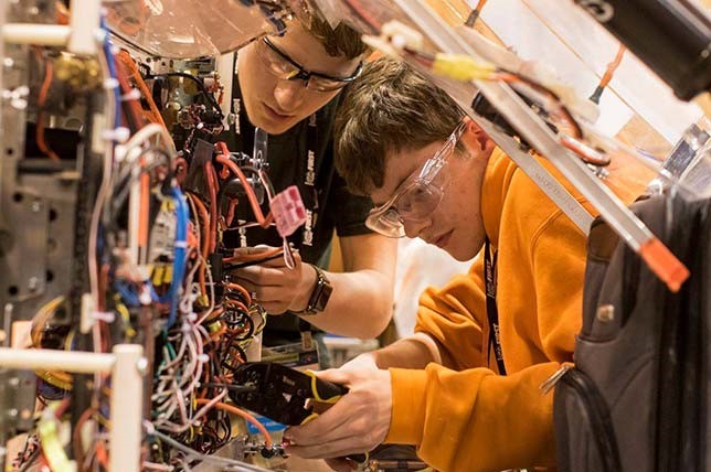 Students work on their team robot at FIRST Championship.