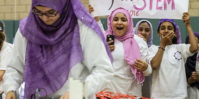 FemSTEM students participate in a FIRST LEGO League tournament.