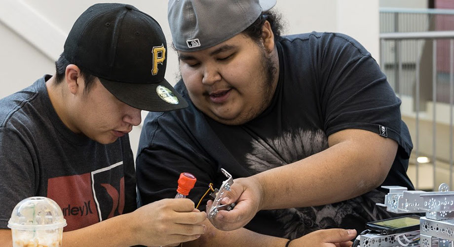 First Nation Kipohtakaw Education Centre students work on robot (Photo by James McGee)