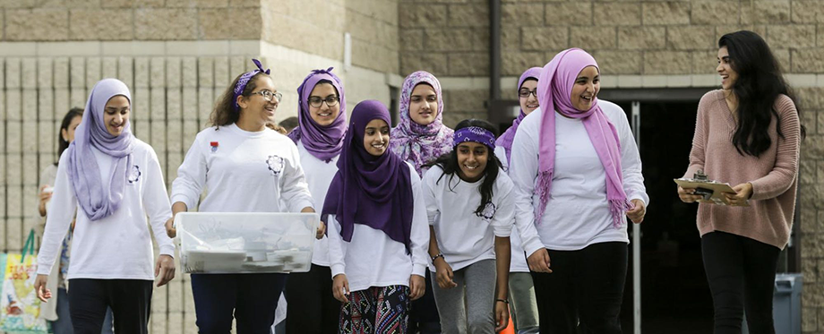 FIRST LEGO League alum and coach Zaina Siyed (far right) with her FemSTEM team.