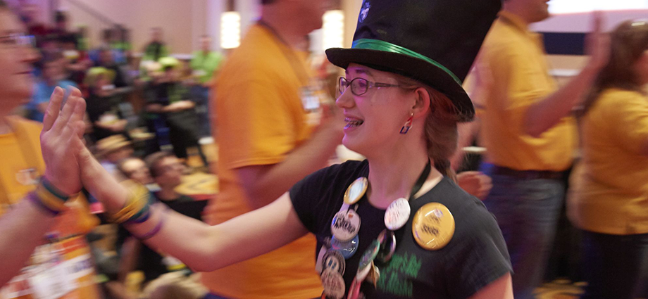 Katie Johnson celebrates with volunteers during the FIRST Tech Challenge award ceremony at the 2015 FIRST Championship.