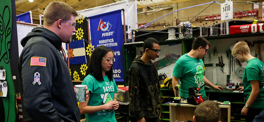 Casey Kreiter checks out the pit for FIRST Robotics Competition Team 1410 at a 2017 regional event in Denver. (Courtesy the Denver Broncos)