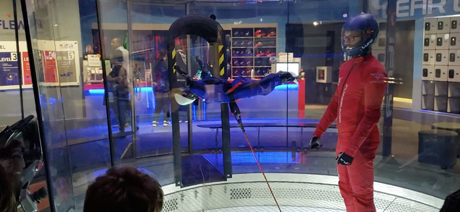 With the help of an iFLY flight instructor inside a wind tunnel, students the Bionic Wolves test their flying humanoid robot.
