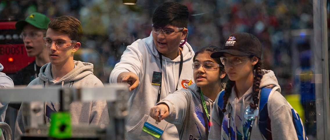 High school students at FIRST robotics event