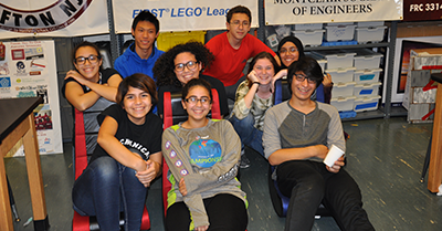 Members of the Mechanical Mustangs sit in rockers, a DonorsChoose.org donation.